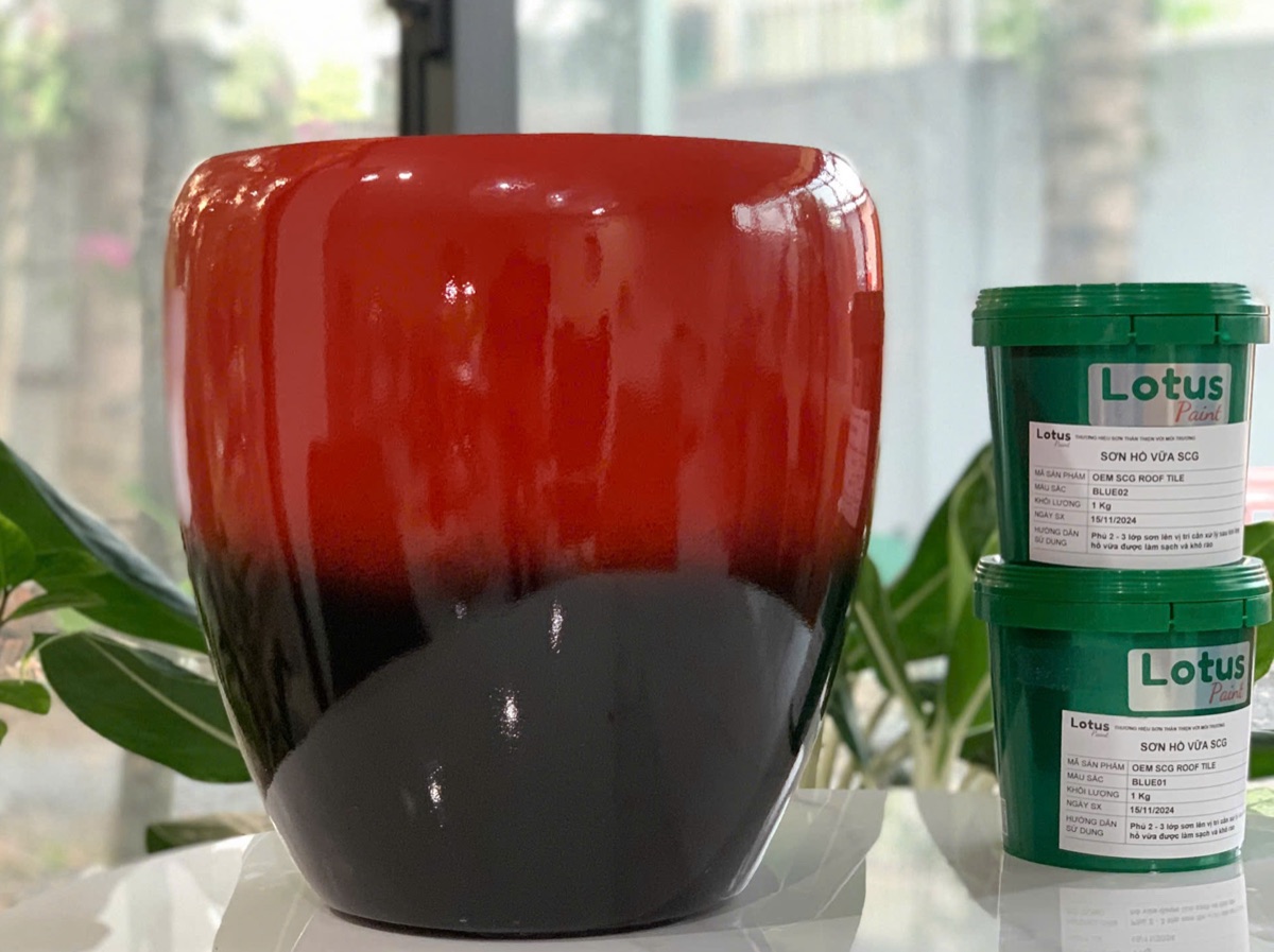Gloss red composite planter staged beside Lotus coating products